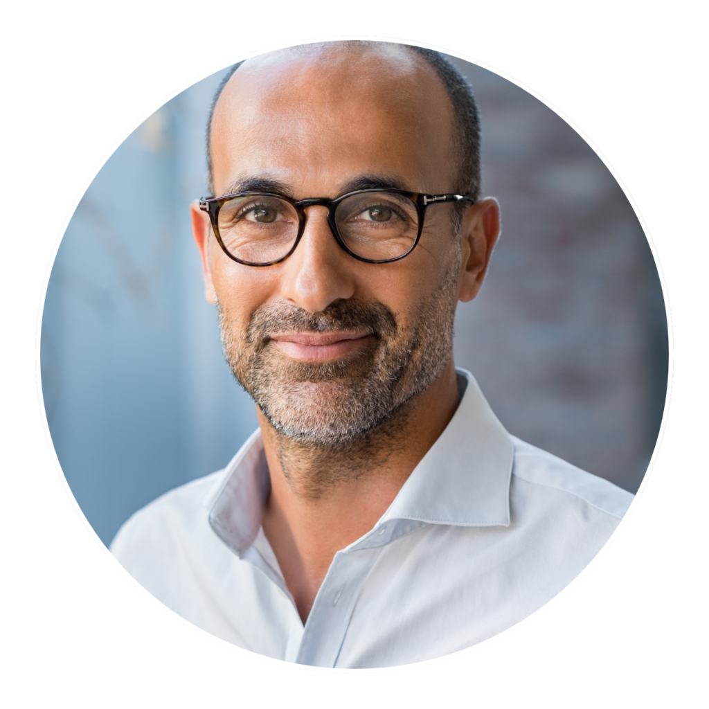 older man with glasses smiling